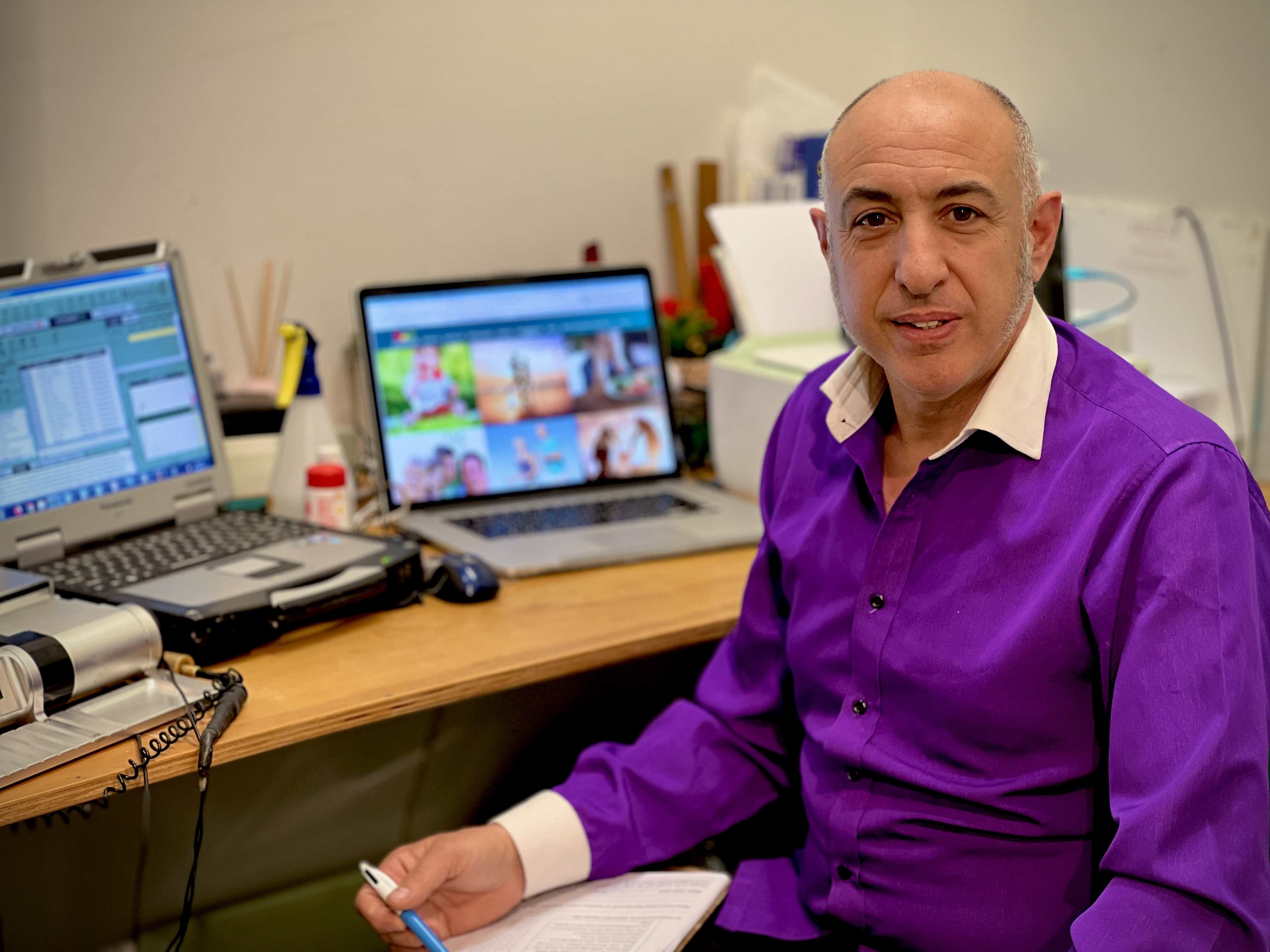 Douglas Mizzi, Clinical Nutritionist, reviewing a client history